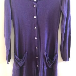 Sweater dress with silk trim at bottom.